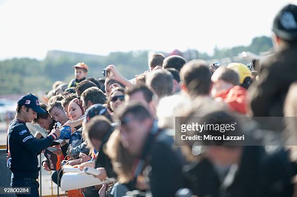Dani Pedrosa of Spain and Repsol Honda Team signs autographs for fans during the event "Riders for Health" of last round of Comunitat Valenciana...