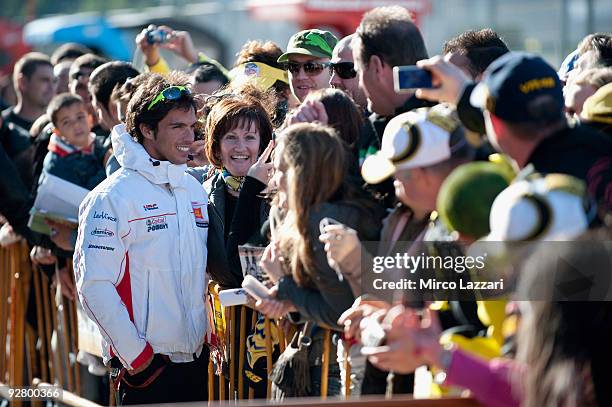 Toni Elias of Spain and San Carlo Honda Gresini poses for fans during the event "Riders for Health" of last round of Comunitat Valenciana Grand Prix...