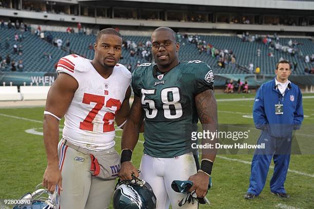 Defensive end Trent Cole of the Philadelphia Eagles and defensive end Osi Umenyiora of the New York Giants pose for a photo on November 1, 2009 at...