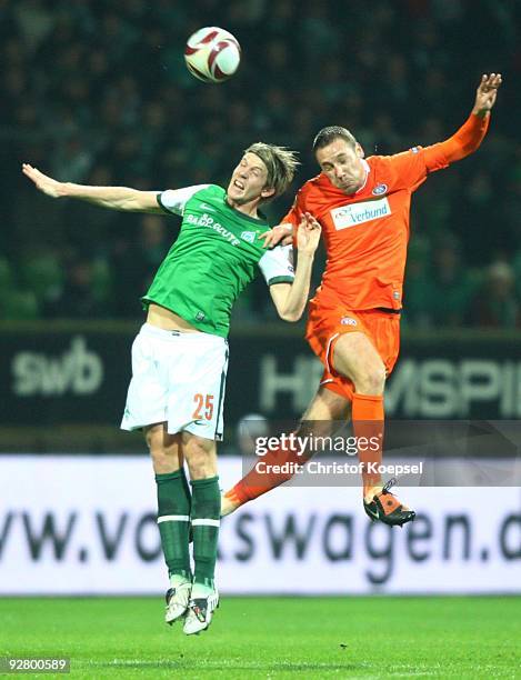 Peter Niemeyer of Bremen and Aleksandar Dragovic of Austria jump for header during the UEFA Europa League Group L match between Werder Bremen and...