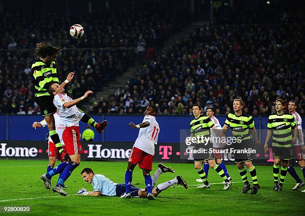 David Rozehnal of Hamburg stops a shot from Georgios Samaras of Celtic during the UEFA Europa League game between Hamburger Sv and Glasgow Celtic on...