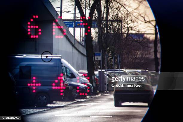 Speedometer of the police measures the speed of road users on February 27, 2018 in Berlin, Germany. The upper value describes the distance and the...