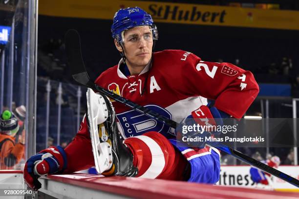 Adam Cracknell of the Laval Rocket stretches during the warm-up against the Bridgeport Sound Tigers prior to the AHL game at Place Bell on March 2,...