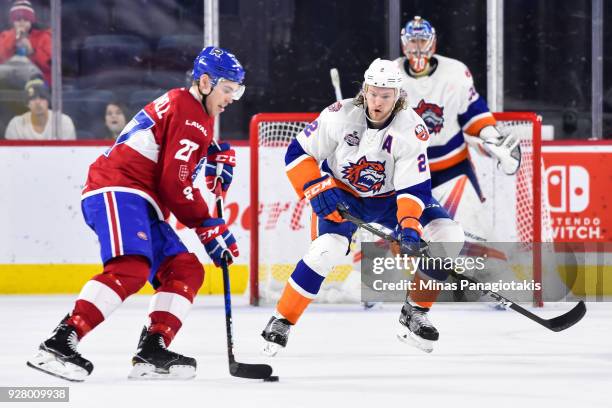 Seth Helgeson of the Bridgeport Sound Tigers looks to defend against Adam Cracknell of the Laval Rocket during the AHL game at Place Bell on March 2,...