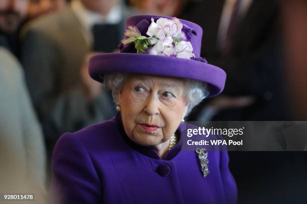 Queen Elizabeth II greets guests during a visit to the International Maritime Organization to mark the 70th anniversary of its formation on March 6,...