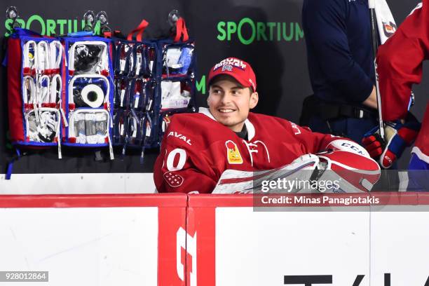 Golatender Zachary Fucale of the Laval Rocket smiles as he looks on from the bench against the Bridgeport Sound Tigers during the AHL game at Place...