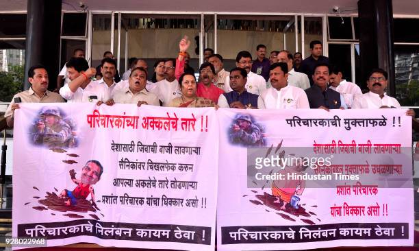 Shiv Sena party MLAs protest against MLA Prashant Paricharak during budget session at Vidhan Bhavan on March 5, 2018 in Mumbai, India. The BJP-backed...