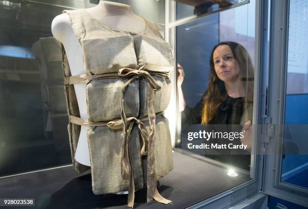 Lauren Hogan looks at lifebelt from the Titanic, one of only a couple that remain in existence, that was given by a survivor to a waiter working on...