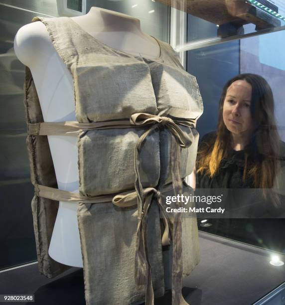 Lauren Hogan looks at lifebelt from the Titanic, one of only a couple that remain in existence, that was given by a survivor to a waiter working on...