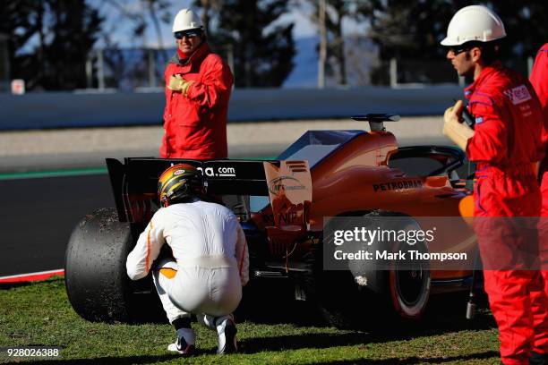 Stoffel Vandoorne of Belgium and McLaren F1 inspects his car after stopping on track during day one of F1 Winter Testing at Circuit de Catalunya on...