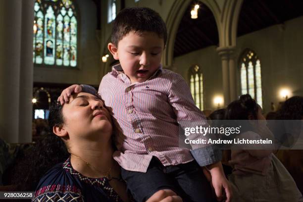 Amanda Morales Guerra, an immigrant from Guatemala, attends a Sunday church service at the Holyrood Church on March 4, 2018 in the Washington Heights...