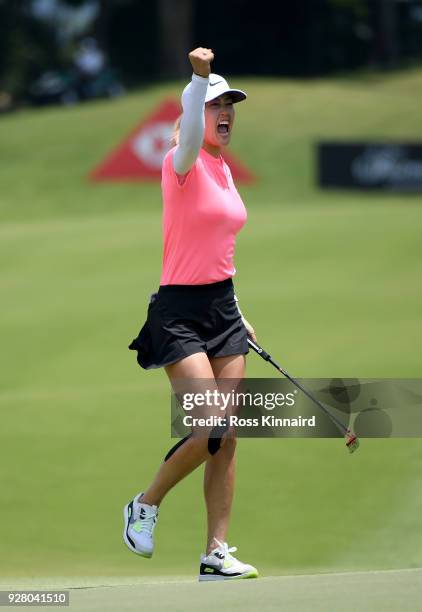 Picture 9 of 9 in a sequence showing the winning putt and celebration of Michelle Wie of the United States on the 18th green during the final round...