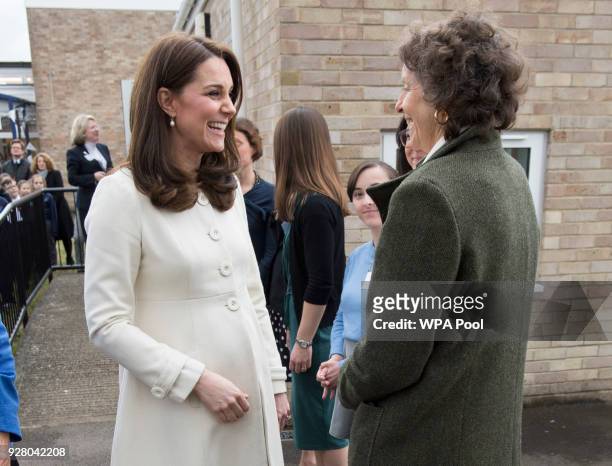 Catherine, Duchess of Cambridge talks to Rosalind Portman Founding Trustee of Family Links as she arrives to learn about the work of the charity...