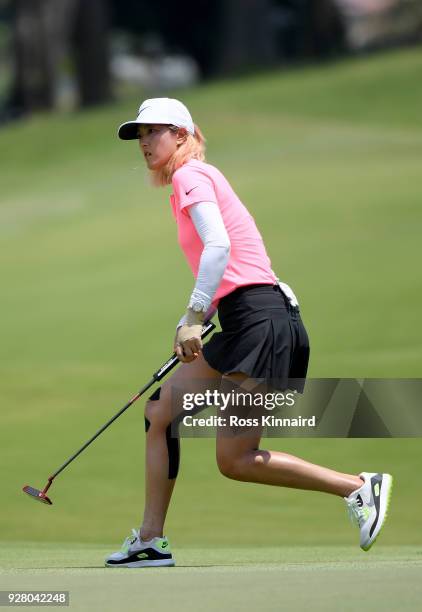 Picture 2 of 9 in a sequence showing the winning putt and celebration of Michelle Wie of the United States on the 18th green during the final round...