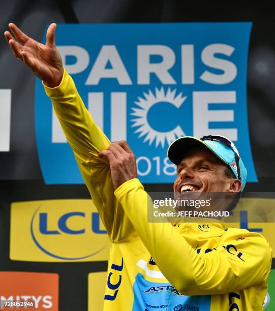 New overall leader Astana team Spanish rider Luis Leon Sanchez puts on the yellow jersey on the podium after the third stage of the Paris - Nice...