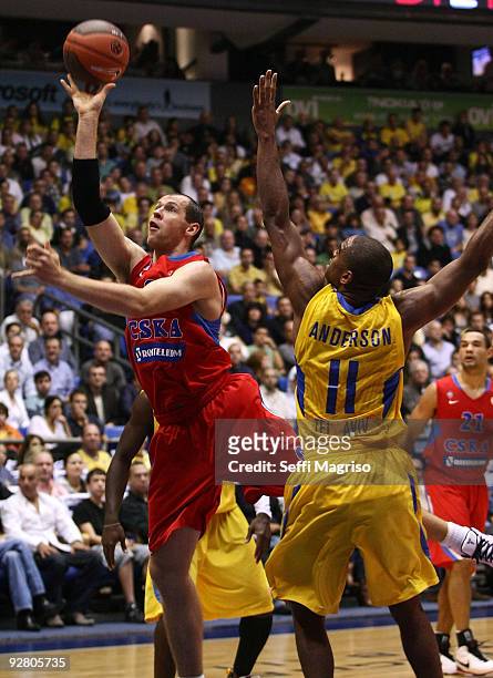 Ramunas Siskauskas of CSKA Moscow competes with Alan Anderson of Maccabi Electra during the Euroleague Basketball Regular Season 2009-2010 Game Day 3...