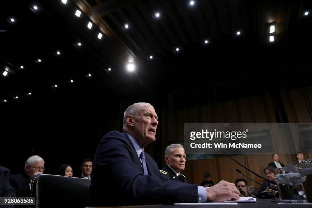 Director of National Intelligence Daniel Coats and U.S. Army Lt. Gen. Robert P. Ashley , director of the Defense Intelligence Agency, answer...