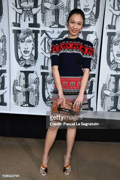 Guest attends the Miu Miu show as part of the Paris Fashion Week Womenswear Fall/Winter 2018/2019 on March 6, 2018 in Paris, France.