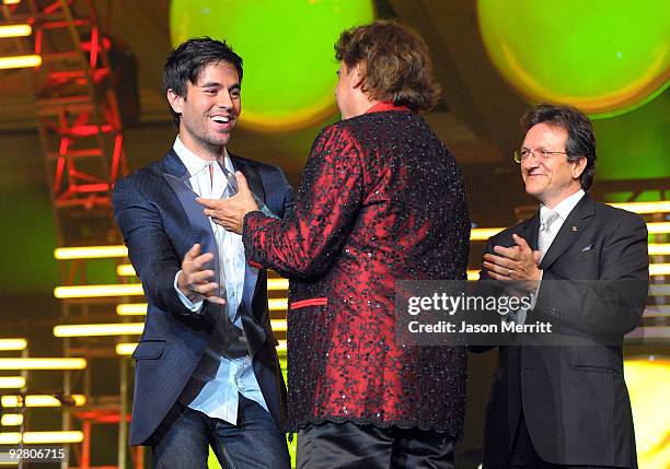 Singer Enrique Iglesias, honoree Juan Gabriel, and Latin Recording president Gabriel Abaroa speak onstage during the 2009 Person of the Year honoring...