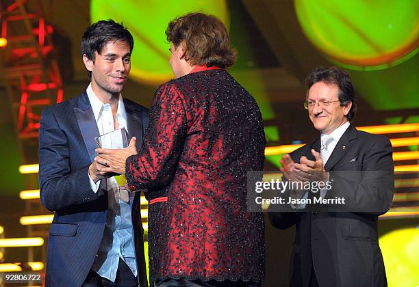 Singer Enrique Iglesias, honoree Juan Gabriel, and Latin Recording president Gabriel Abaroa speak onstage during the 2009 Person of the Year honoring...