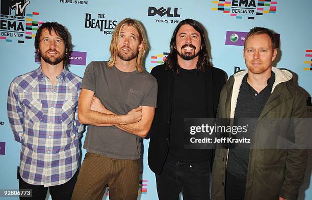 Taylor Hawkins, Chris Shiflett, Dave Grohl and Nate Mendel of Foo Fighters arrive for the 2009 MTV Europe Music Awards held at the O2 Arena on...