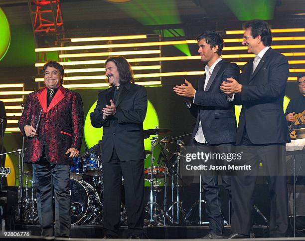 Honoree Juan Gabriel, Chairman of the Latin Recording Academy Luis Cobos, singer Enrique Iglesias, and Latin Recording president Gabriel Abaroa speak...