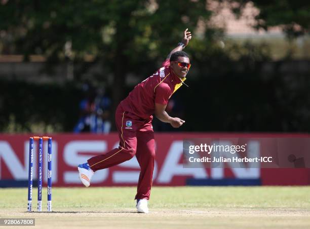 Jason Mohammed of The West Indies bowls during The ICC Cricket World Cup Qualifier between The West Indies and The UAE at The Old Hararians Ground on...