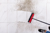 Broom Cleaning Dirt On Tiled Floor