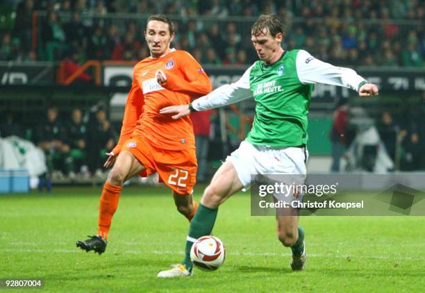 Marin Leovac of Austria and Tim Borowski of Bremen battle for the ball during the UEFA Europa League Group L match between Werder Bremen and Austria...
