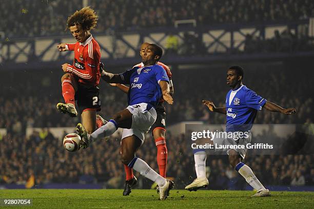 Sylvain Distin of Everton blocks the shot of David Luiz of Benfica during the UEFA Europa League Group I match between Everton and Benfica at...