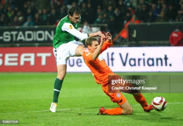 Hugo Almeida of Bremen and Florian Klein of Austria battle for the ball during the UEFA Europa League Group L match between Werder Bremen and Austria...