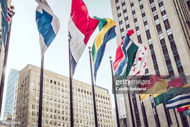 national ( state) flags in midtown manhattan - insignia stock pictures, royalty-free photos & images