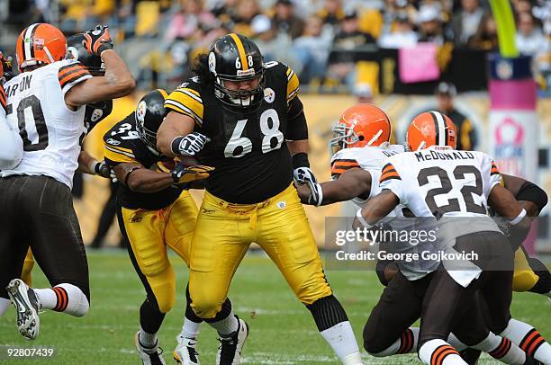 Offensive lineman Chris Kemoeatu of the Pittsburgh Steelers blocks for running back Willie Parker during a game against the Cleveland Browns at Heinz...