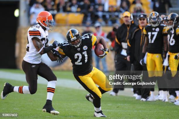 Cornerback Brandon McDonald of the Cleveland Browns tries to tackle running back Mewelde Moore of the Pittsburgh Steelers during a game at Heinz...