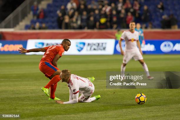 Rony Martinez of CD Olimpia of Honduras fouls Daniel Royer during 2018 CONCACAF Champions League round of 16 game at Red Bull arena. Red Bulls won 2...