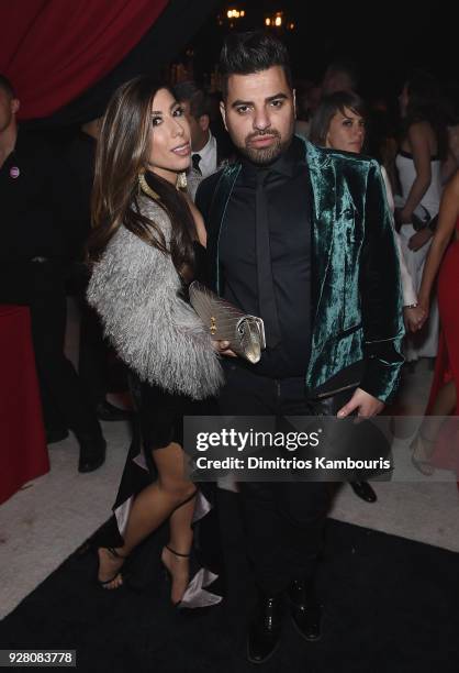 Marigo Mihalos and guest attend the 26th annual Elton John AIDS Foundation Academy Awards Viewing Party sponsored by Bulgari, celebrating EJAF and...