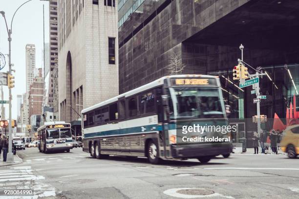 public transportation buses on fifth avenue , midtown manhattan - american gothic stock-fotos und bilder