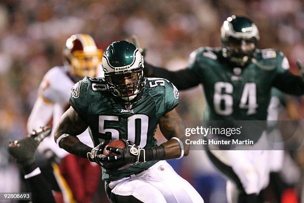 Linebacker Will Witherspoon of the Philadelphia Eagles intercepts a pass and runs for a touchdown during a game against the Washington Redskins on...