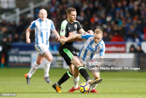 Huddersfield Town's Alex Pritchard battles for the ball during the Premier League match at the John Smith's Stadium, Huddersfield
