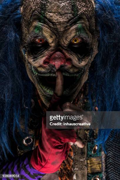 creepy clown with finger on lips - evil clown stock pictures, royalty-free photos & images