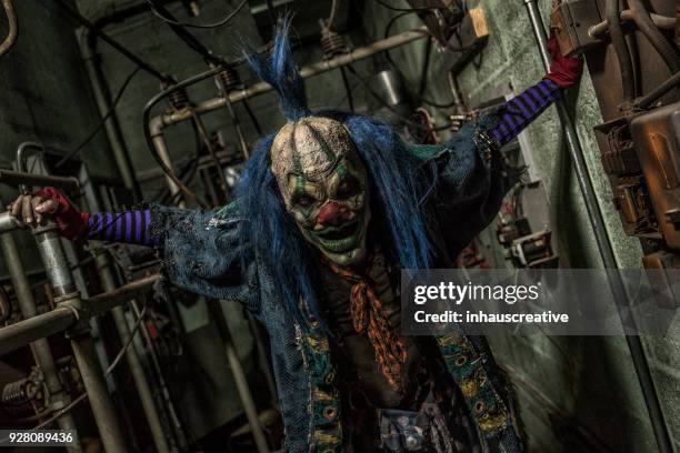 creepy clown in hallway - serial killings stock pictures, royalty-free photos & images