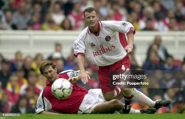 Tony Adams of Arsenal tackles Graham Stuart of Charlton Athletic during the FA Carling Premier League match between Arsenal and Charlton Athletic at...