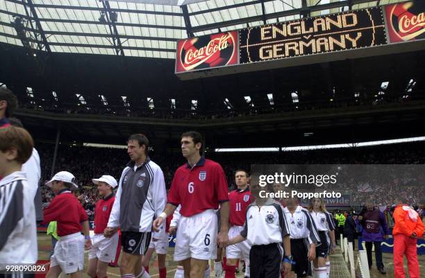 The England and Germany teams walk out prior to the match between England and Germany in the European Group 9 World Cup Qualifier at Wembley Stadium,...