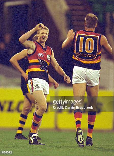 Brett Burton and Matthew Robran for Adelaide celebrate a goal during the round eight AFL match between the Richmond Tigers and the Adelaide Crows...