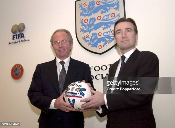 Newly appointed England coach Sven Goran Eriksson and FA Chief Executive Adam Crozier pose for the media during the Press Conference held to announce...