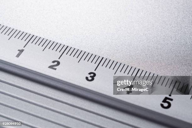 ruler scale macrophotography - nun with ruler stock-fotos und bilder