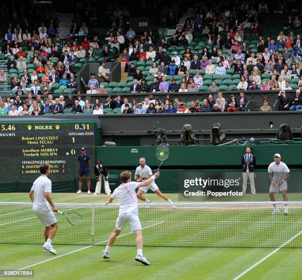 Jonathan Marray of Great Britain and Frederik Nielsen of Denmark during their men's doubles final against Robert Lindstedt of Sweden and Horia Tecau...