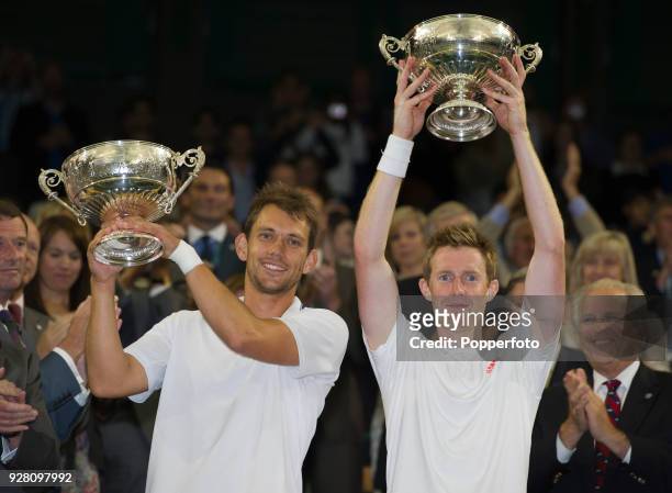 Jonathan Marray of Great Britain and Frederik Nielsen of Denmark with the men's doubles trophy after defeating Robert Lindstedt of Sweden and Horia...