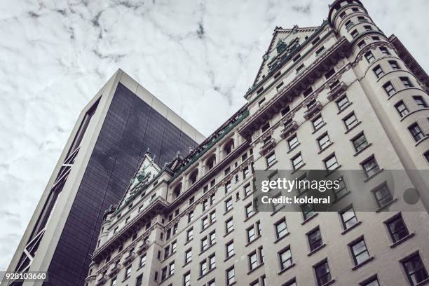 urban skyline . fifth avenue plaza hotel, midtown manhattan - taking a vintage ny taxi cab stock pictures, royalty-free photos & images