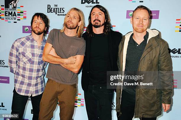 Taylor Hawkins, Nate Mendel, Dave Grohl and Chris Shiflett of the Foo Fighters arrive for the 2009 MTV Europe Music Awards held at the O2 Arena on...